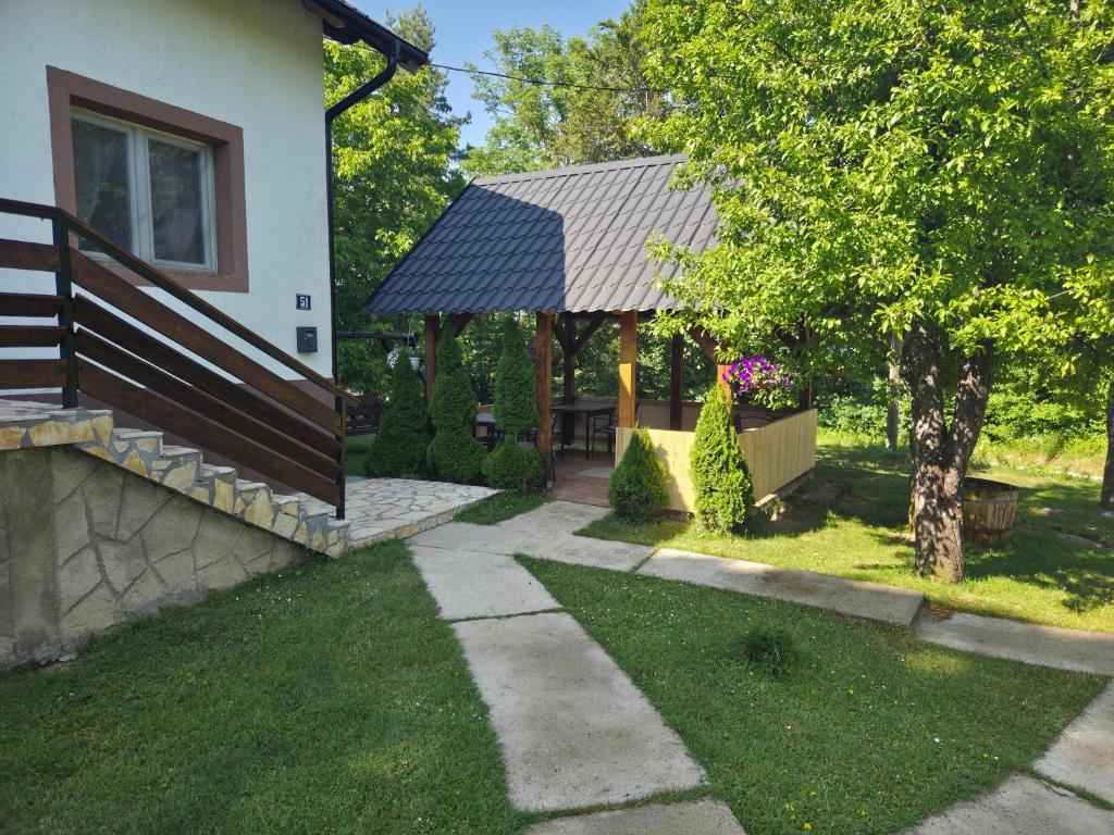 Country House Plitvice - garden, gazebo and entrance of the country house